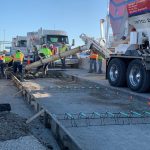 On-Demand Concrete pouring ready mix concrete on a highway